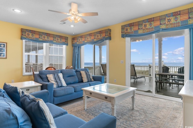 17 N Seaside Dr, Surfside Beach, SC 29575 - living room with ceiling fan, wood finished floors, a water view, and recessed lighting