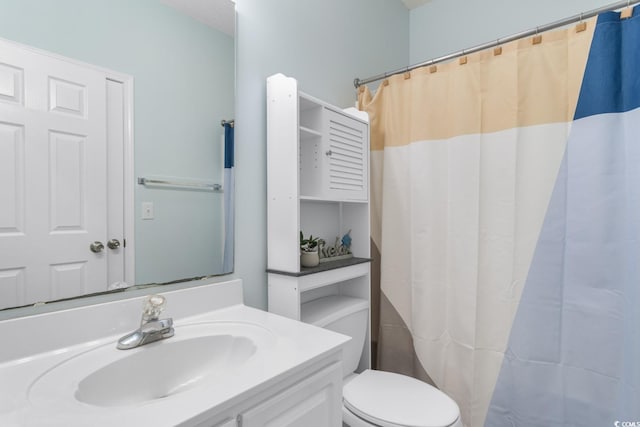 17 N Seaside Dr, Surfside Beach, SC 29575 - bathroom with toilet, vanity, and curtained shower