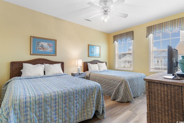 17 N Seaside Dr, Surfside Beach, SC 29575 - bedroom with light wood-type flooring and ceiling fan
