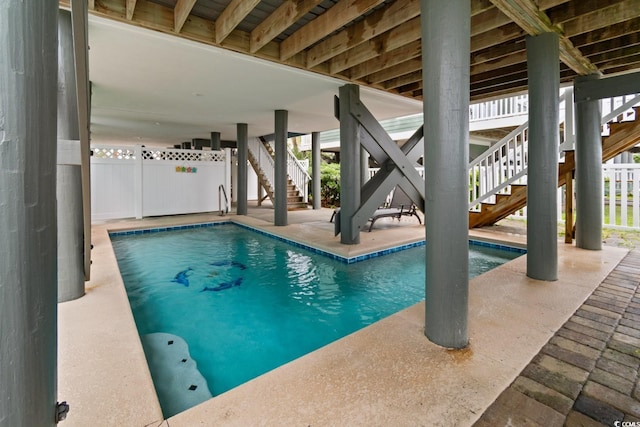 17 N Seaside Dr, Surfside Beach, SC 29575 - view of pool featuring stairs, a swimming pool, and a patio area