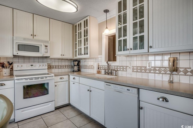 5905 S Kings Hwy Unit 1717, Myrtle Beach, SC 29575 - kitchen featuring white appliances, a sink, backsplash, and light tile patterned floors