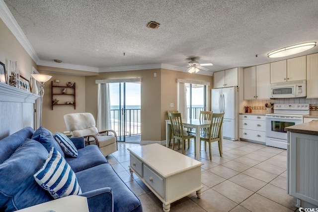 5905 S Kings Hwy Unit 1717, Myrtle Beach, SC 29575 - living room featuring crown molding, a ceiling fan, light tile patterned floors, and a textured ceiling
