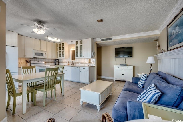 5905 S Kings Hwy Unit 1717, Myrtle Beach, SC 29575 - living room featuring light tile patterned flooring, a ceiling fan, a textured ceiling, and ornamental molding