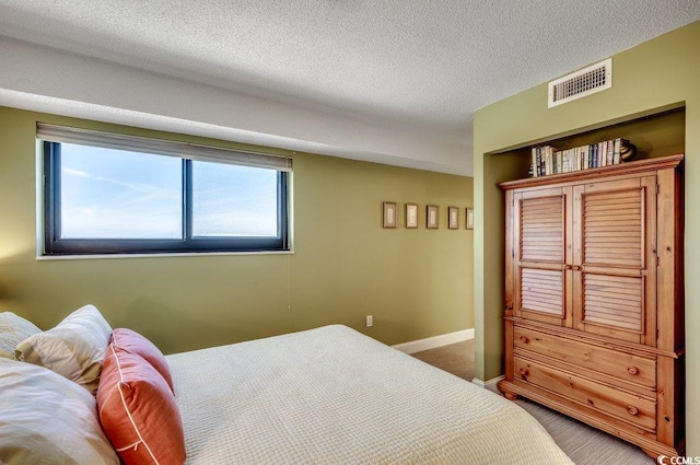 5905 S Kings Hwy Unit 1717, Myrtle Beach, SC 29575 - carpeted bedroom featuring baseboards and a textured ceiling