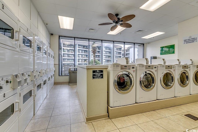 5905 S Kings Hwy Unit 1717, Myrtle Beach, SC 29575 - shared laundry room featuring stacked washing machine and dryer, washer and clothes dryer, light tile patterned flooring, a ceiling fan, and baseboards