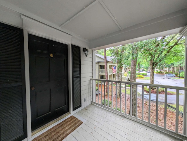 wooden terrace with a porch
