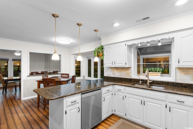 8207 Timber Ridge Rd, Conway, SC 29526 - kitchen featuring a sink, dishwasher, crown molding, a peninsula, and white cabinetry
