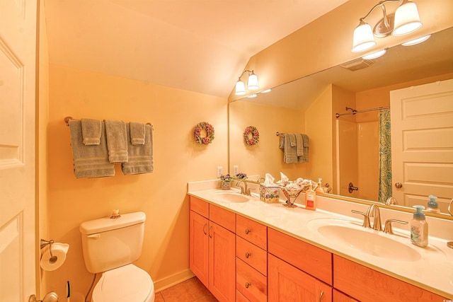 full bath with toilet, tile patterned floors, double vanity, a shower with curtain, and lofted ceiling