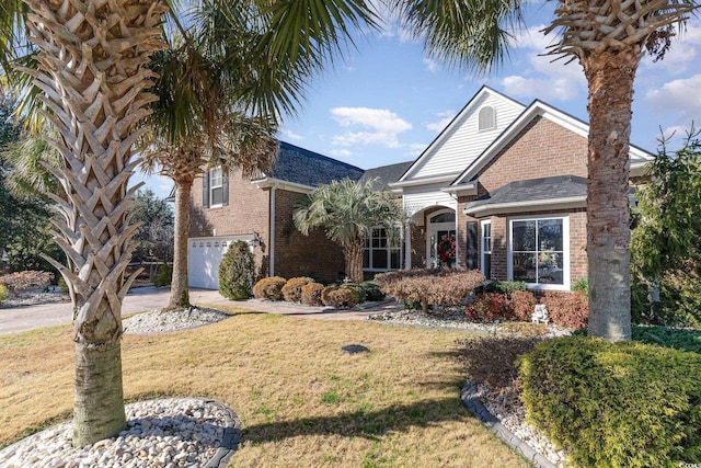 4608 Grovecrest Cir N, Myrtle Beach, SC 29582 - traditional-style home with brick siding, a front lawn, and an attached garage