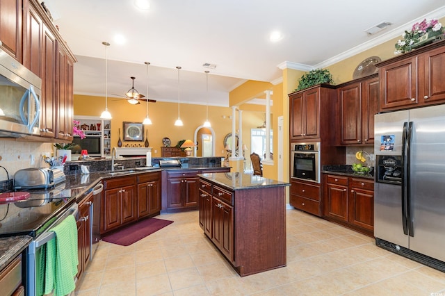 4608 Grovecrest Cir N, Myrtle Beach, SC 29582 - kitchen with stainless steel appliances, a peninsula, ornamental molding, tasteful backsplash, and a sink
