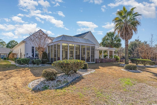 4608 Grovecrest Cir N, Myrtle Beach, SC 29582 - back of house with a pergola, a sunroom, and a lawn