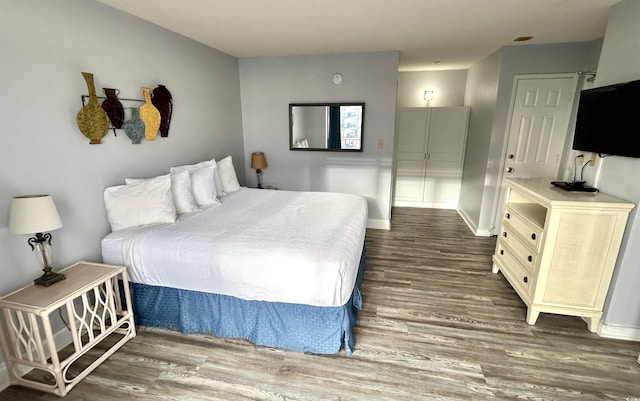 1905 S Ocean Blvd Unit 922-924, Myrtle Beach, SC 29577 - bedroom with dark wood finished floors and baseboards