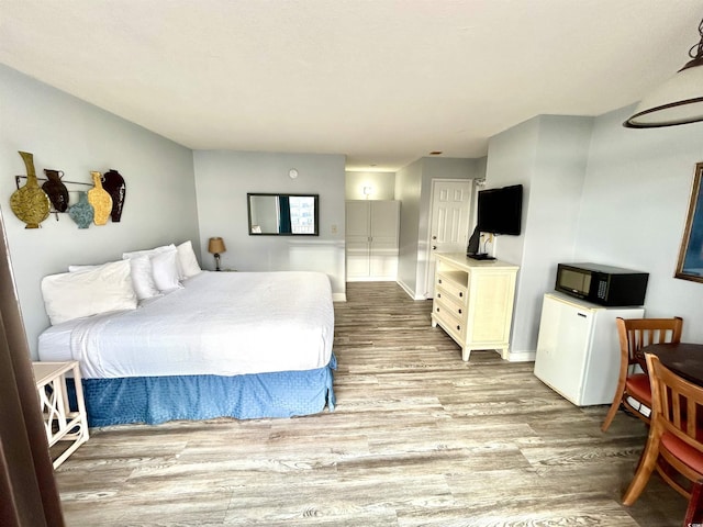 1905 S Ocean Blvd Unit 922-924, Myrtle Beach, SC 29577 - bedroom featuring wood finished floors and baseboards