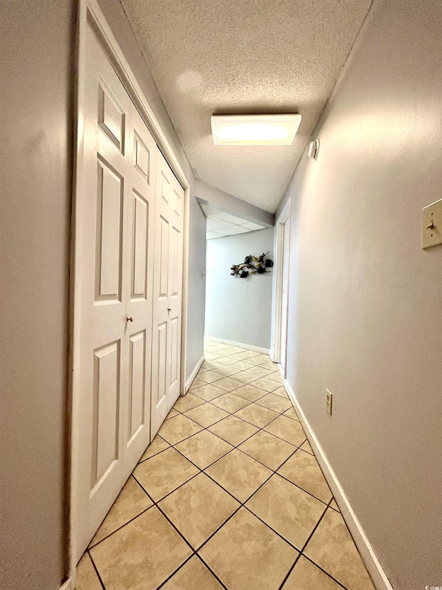 1905 S Ocean Blvd Unit 922-924, Myrtle Beach, SC 29577 - hallway with light tile patterned floors and a textured ceiling