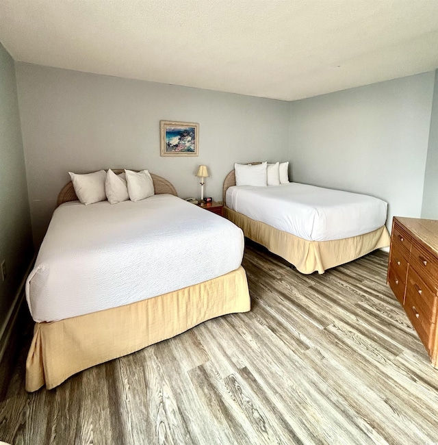 1905 S Ocean Blvd Unit 922-924, Myrtle Beach, SC 29577 - bedroom featuring wood finished floors