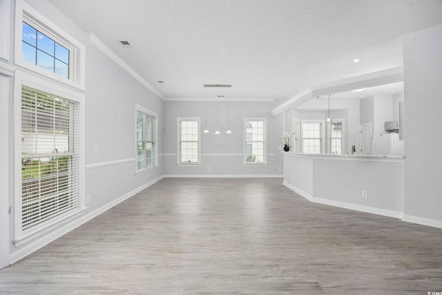 9831 Winchester Ct, Murrells Inlet, SC 29576 - unfurnished living room featuring wood finished floors, ornamental molding, a chandelier, and recessed lighting