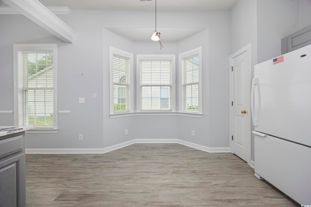 9831 Winchester Ct, Murrells Inlet, SC 29576 - unfurnished dining area featuring plenty of natural light and light wood finished floors