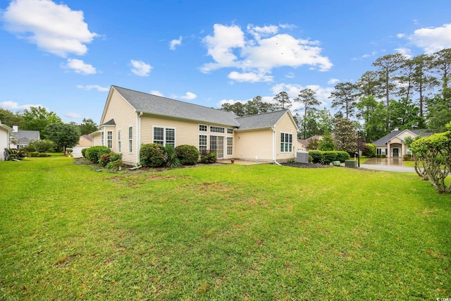 9831 Winchester Ct, Murrells Inlet, SC 29576 - rear view of house with a yard and a patio