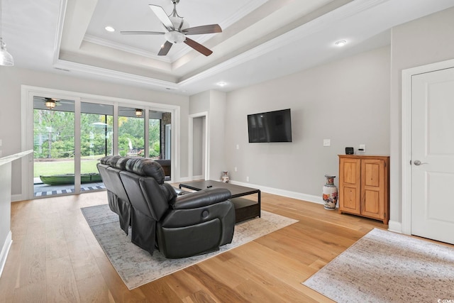 2204 Woodstork Dr, Conway, SC 29526 - living area featuring a ceiling fan, ornamental molding, a tray ceiling, light wood-type flooring, and recessed lighting