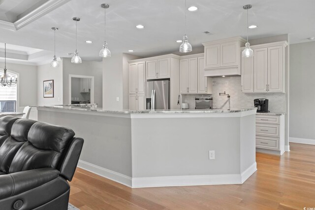 2204 Woodstork Dr, Conway, SC 29526 - kitchen featuring stainless steel fridge, open floor plan, decorative backsplash, light wood-style flooring, and recessed lighting