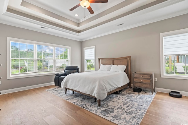 2204 Woodstork Dr, Conway, SC 29526 - bedroom featuring ornamental molding, multiple windows, a raised ceiling, wood finished floors, and baseboards