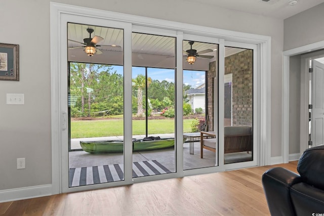 2204 Woodstork Dr, Conway, SC 29526 - entryway featuring a ceiling fan, healthy amount of natural light, wood finished floors, and baseboards