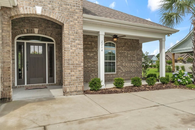 2204 Woodstork Dr, Conway, SC 29526 - doorway to property with brick siding, roof with shingles, and covered porch