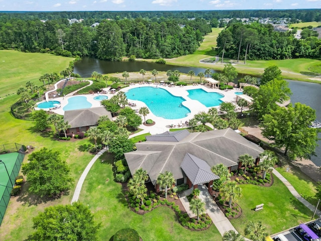 2204 Woodstork Dr, Conway, SC 29526 - bird's eye view of a pool, a nearby body of water, and a tree filled landscape