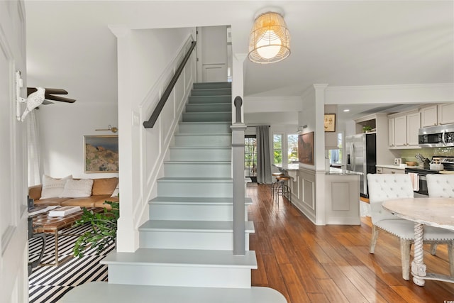 2170 Deerfield Ave, Surfside Beach, SC 29575 - stairs featuring hardwood / wood-style floors, ornamental molding, and a ceiling fan
