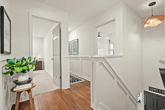 2170 Deerfield Ave, Surfside Beach, SC 29575 - hall featuring light wood-style floors, a decorative wall, and wainscoting