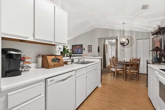193 Charter Dr Unit E7, Longs, SC 29568 - kitchen featuring white appliances, a sink, lofted ceiling, white cabinets, and light countertops