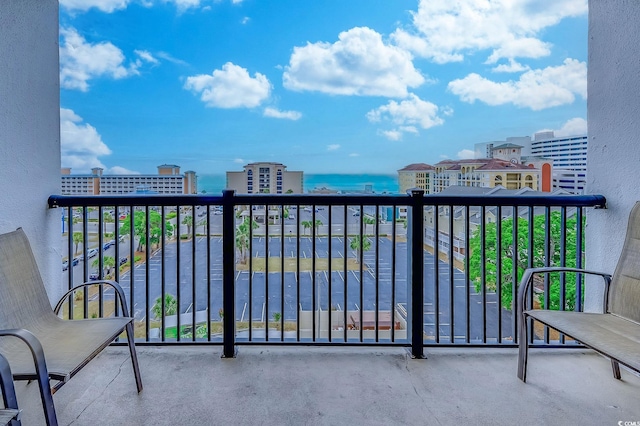 balcony featuring a water view