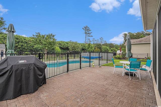 view of patio featuring fence and grilling area
