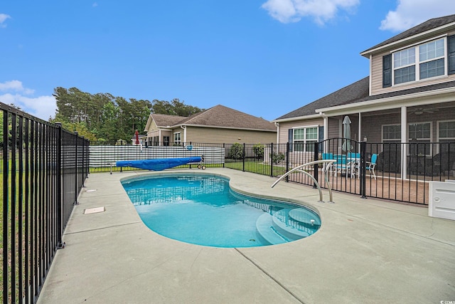 view of swimming pool featuring a patio area and a fenced backyard