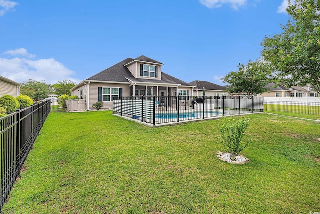 back of property with a sunroom