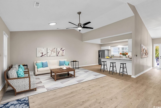 4339 Baldwin Ave Unit 4339, Little River, SC 29566 - living room featuring baseboards, light wood-type flooring, ceiling fan, and lofted ceiling