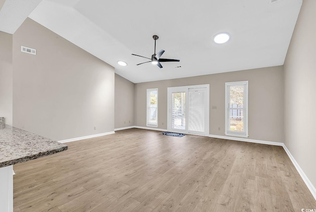 4339 Baldwin Ave Unit 4339, Little River, SC 29566 - unfurnished living room featuring lofted ceiling, a ceiling fan, light wood-type flooring, and baseboards