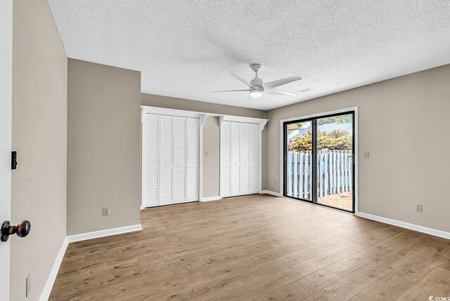 4339 Baldwin Ave Unit 4339, Little River, SC 29566 - unfurnished bedroom with access to outside, wood finished floors, baseboards, a textured ceiling, and a ceiling fan