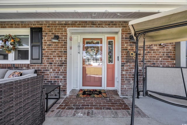 1014 Thomas Ave, North Myrtle Beach, SC 29582 - property entrance featuring brick siding and covered porch