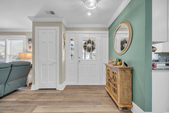 1014 Thomas Ave, North Myrtle Beach, SC 29582 - foyer with light wood-style floors, crown molding, baseboards, and recessed lighting