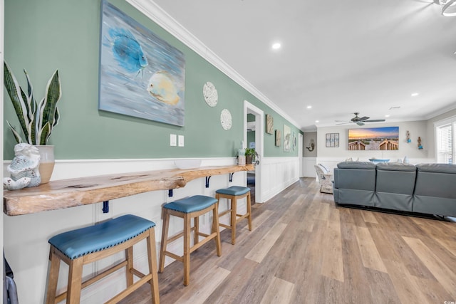 1014 Thomas Ave, North Myrtle Beach, SC 29582 - living room featuring ornamental molding, a wainscoted wall, wood finished floors, recessed lighting, and ceiling fan