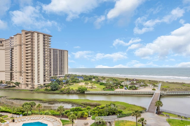 bird's eye view of a large body of water and apartment complex