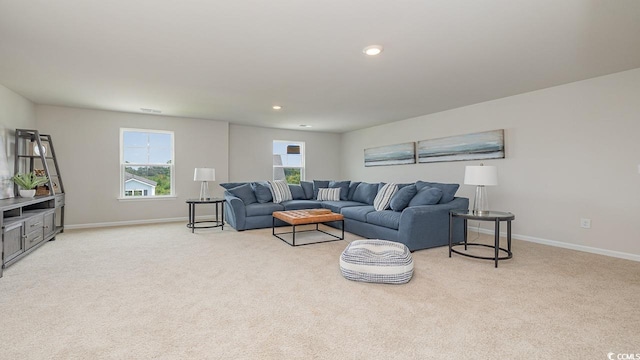 living area with light colored carpet, baseboards, and recessed lighting