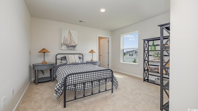 carpeted bedroom featuring baseboards