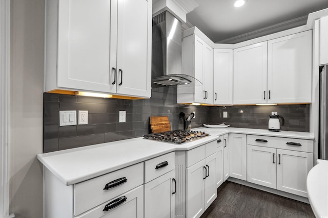 2909 Moss Bridge Ln, Myrtle Beach, SC 29579 - kitchen featuring wall chimney range hood, stainless steel gas stovetop, dark wood-style flooring, light countertops, and white cabinets