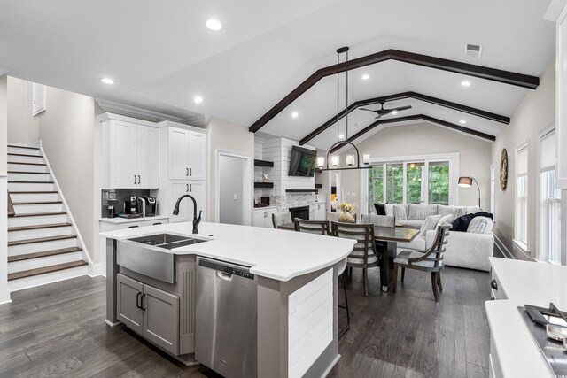 2909 Moss Bridge Ln, Myrtle Beach, SC 29579 - kitchen featuring open floor plan, stainless steel dishwasher, a sink, light countertops, and dark wood finished floors