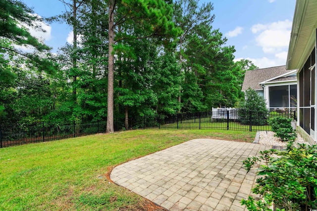 2909 Moss Bridge Ln, Myrtle Beach, SC 29579 - view of yard with a patio area and a sunroom