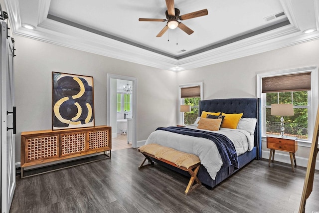 2909 Moss Bridge Ln, Myrtle Beach, SC 29579 - bedroom with a raised ceiling, ornamental molding, wood finished floors, baseboards, and ensuite bath
