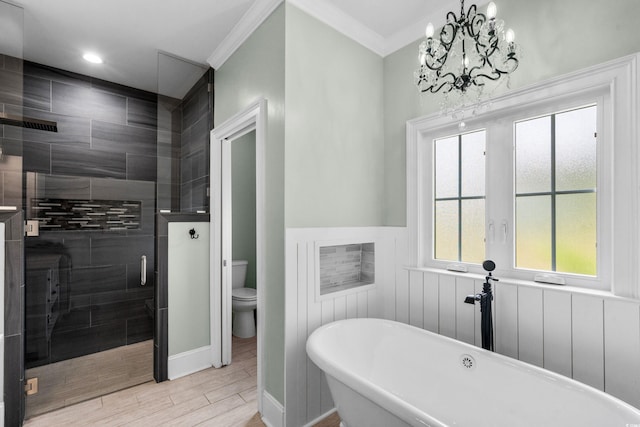 2909 Moss Bridge Ln, Myrtle Beach, SC 29579 - bathroom featuring a shower stall, a freestanding tub, toilet, a chandelier, and wood finished floors