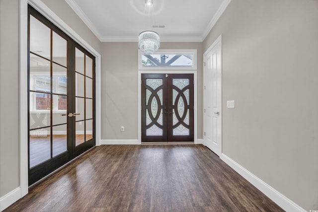 3995 Tillmond Dr, Conway, SC 29526 - foyer entrance with french doors, dark wood finished floors, a chandelier, crown molding, and baseboards